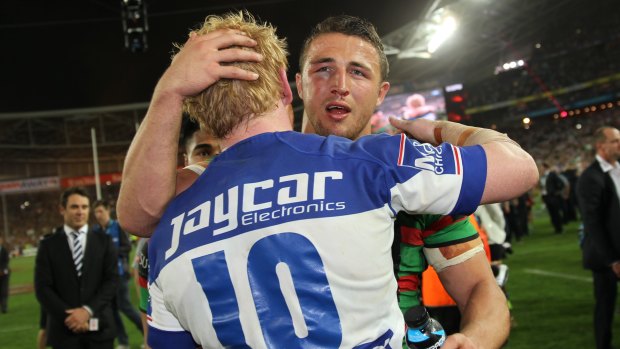 Frenemies: The two English props embrace after the 2014 grand final