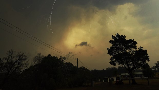 Lightning from a pyroCB storm breaks through while bushfires rage nearby.