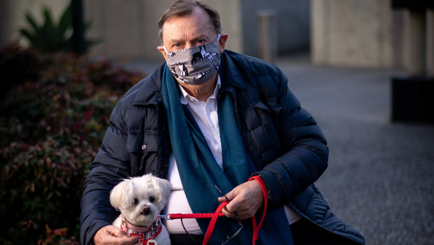 Melbourne-based Harold Mitchell, photographed wearing a mask in line with government rules in the pandemic and with his dog Lilly, is calling for an investigation in relation to ASIC’s conduct of this case. 