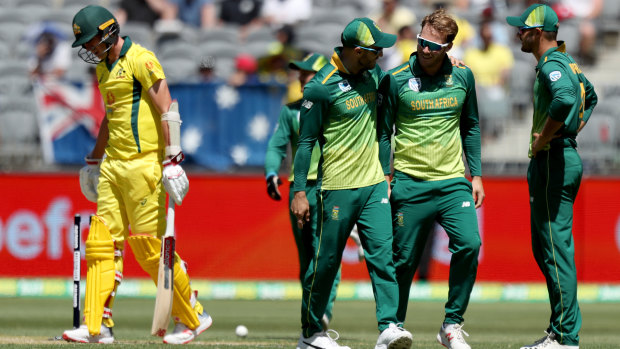 Caught short: South Africa celebrate the run-out of Australia's Pat Cummins during the first ODI of series at Optus Stadium in Perth.