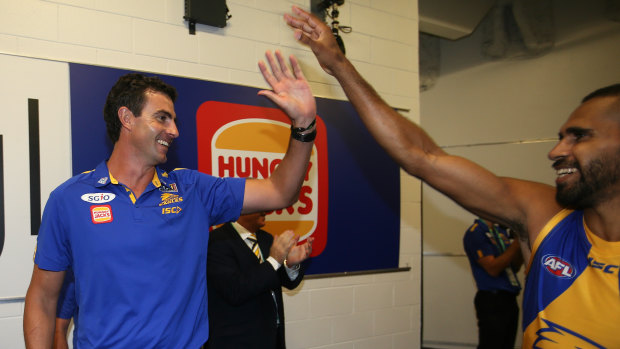 Top job: West Coast's forward line coach Jamie Graham celebrates the Eagles' win over the Bulldogs with Lewis Jetta.