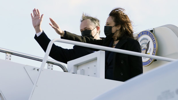 Vice-President Kamala Harris and her husband, Doug Emhoff, wave as they board Air Force Two at Andrews Air Force Base, Maryland. 
