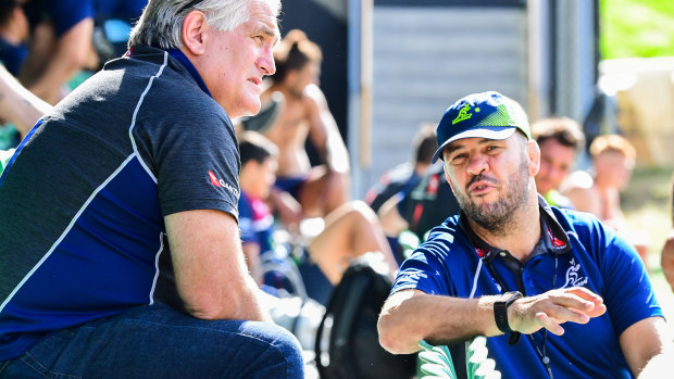 Scott Johnson (left) and Michael Cheika chat during a Wallabies training session in July, 2019.