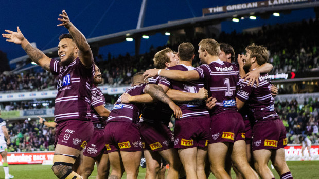 Manly celebrate their narrow win against the Raiders in Canberra on Sunday.