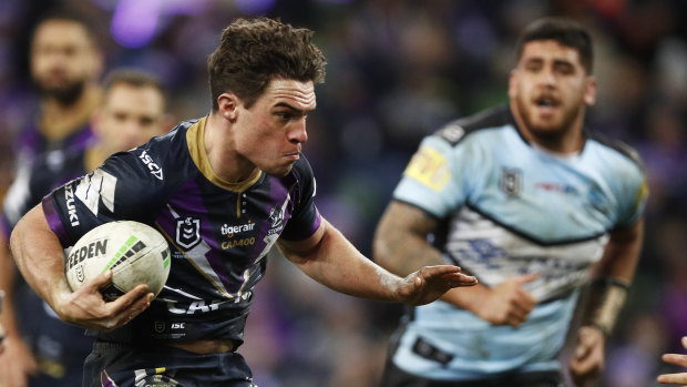 Brodie Croft of the Melbourne Storm makes a run against the Sharks in round 17.