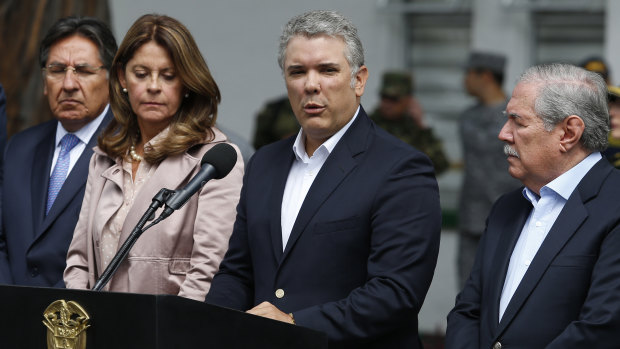 Colombia's President Ivan Duque gives a statement inside the General Santander police academy following the bombing.