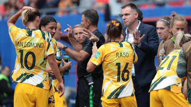 Matildas coach Ante Milicic talks to his players during the clash with Italy.