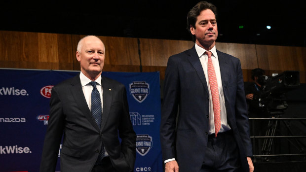 AFL Commission chairman Richard Goyder (left) and AFL CEO Gillon McLachlan arrive at the North Melbourne grand final breakfast on Saturday.