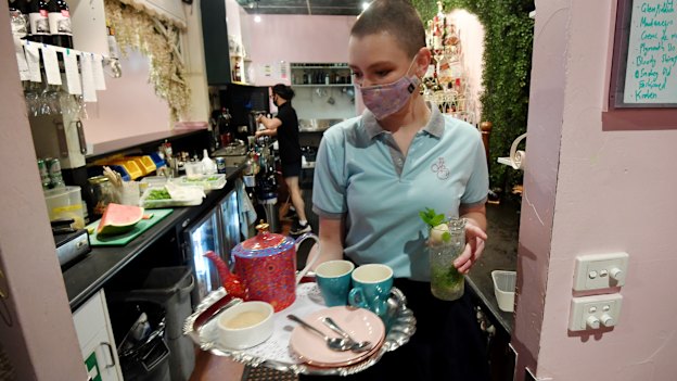Ebony McMasters and Nick Triantafillopoulos at work behind the bar.