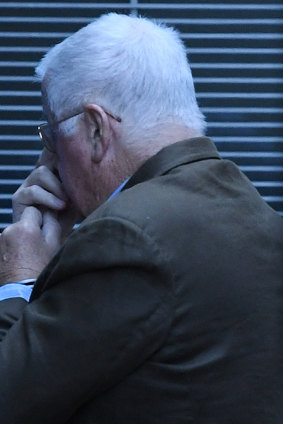 Leonard John Warwick is escorted from a corrective services van as he arrives at the Supreme Court at the beginning of his trial.