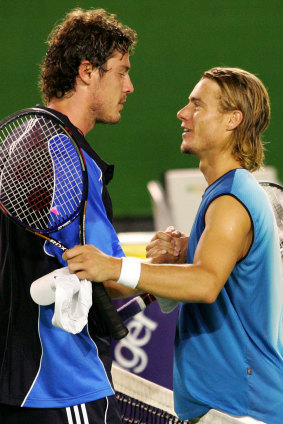 Safin (left) is congratulated by Lleyton Hewitt after the 2005 Australian Open final.