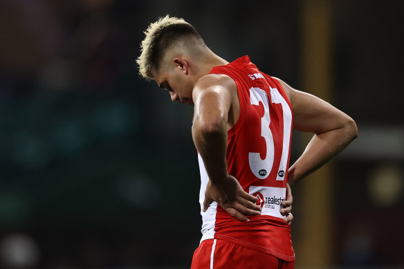 A dejected Elijah Taylor after making his AFL debut for the Swans in the loss to Gold Coast donning the famous 37 worn by Adam Goodes.