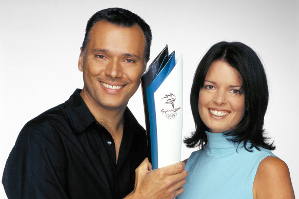 Holmes with Stan Grant ahead of the Sydney Olympics. They married in 2001.