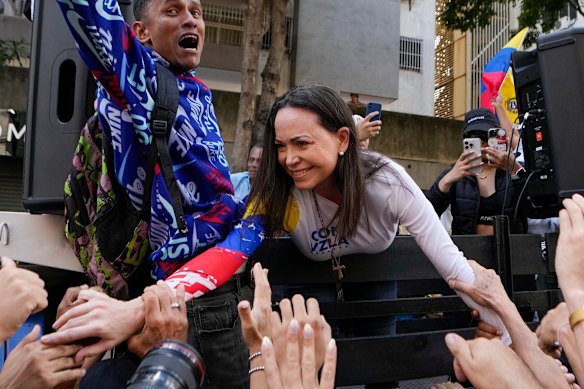 Venezuelan opposition leader Maria Corina Machado greets supporters during a protest against Venezuelan President Nicolas Maduro last year.