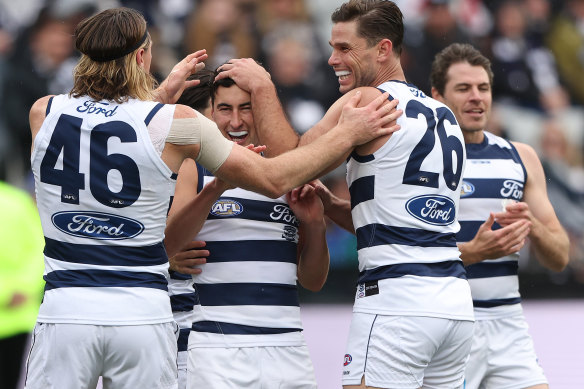 Geelong celebrate a goal against Adelaide.