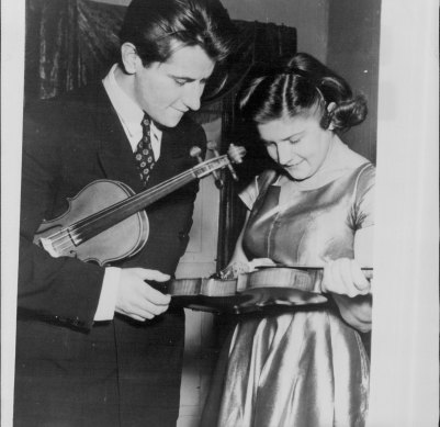 Kimber speaking with Georgi Badev, violinist from Bulgaria, after their performances at the Tchaikovsky International Piano and Violin Competition in Moscow, 1958.