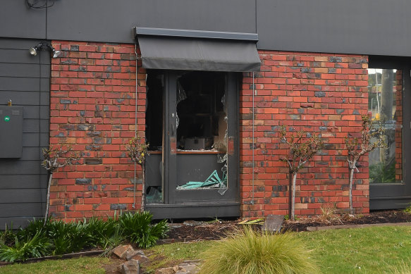 A smashed window could be seen at the burnt-out centre on Monday morning.