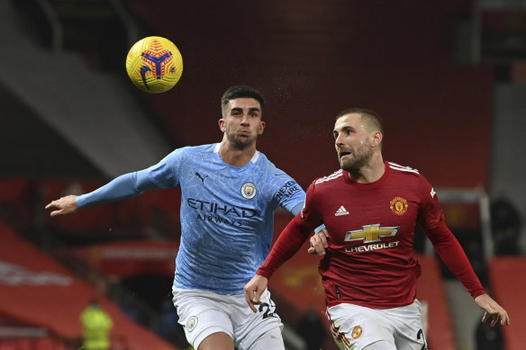 Luke Shaw (right) vies for the ball with Joao Cancelo in the scoreless Manchester derby draw.