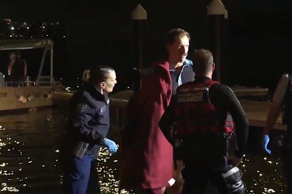 Jesse Hockey warmed up in a blanket up after entering the icy water, while Scott McNamara was dressed in a wetsuit.