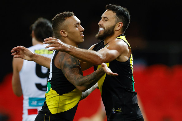 That winning feeling: Shane Edwards, right, celebrates Richmond's win over the Saints with teammate Shai Bolton. 