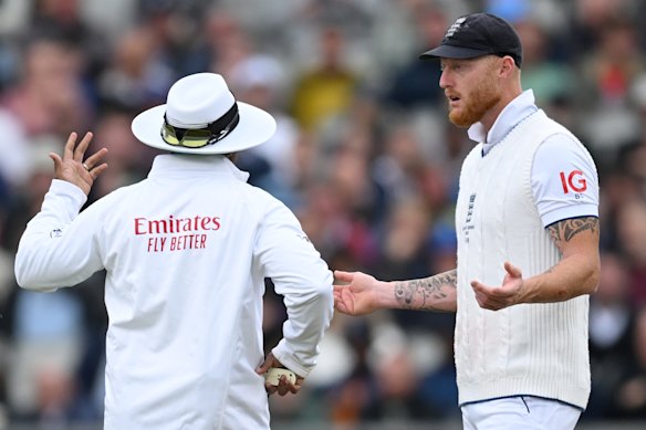 England captain Ben Stokes speaks to an umpire during an Ashes Test.
