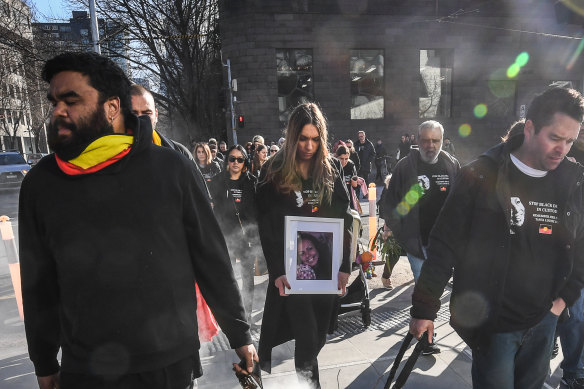 Tanya Day's family and supporters being smoked on their way to the Coroners Court in 2019.