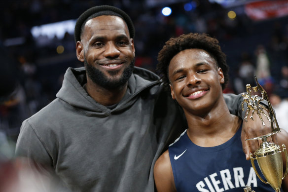 LeBron James, left, poses with his son Bronny.