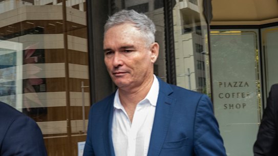 Former federal Labor MP Craig Thomson (centre) leaves Downing Centre Local Court after pleading guilty to fraud offences.