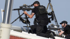 Police snipers on the roof behind Donald Trump moments after he was shot at a rally in Butler, Pennsylvania.