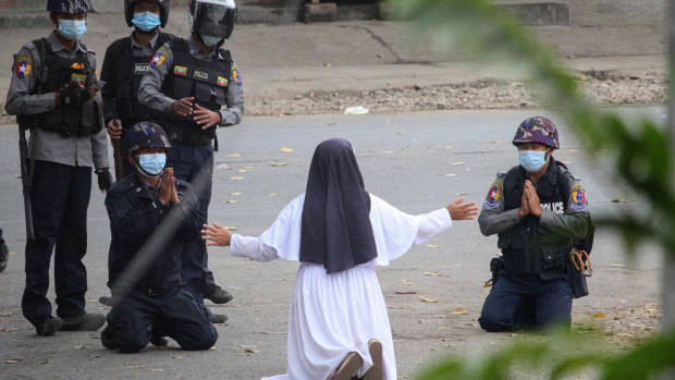 Nun begs Myanmar police to stop but killing continues around her