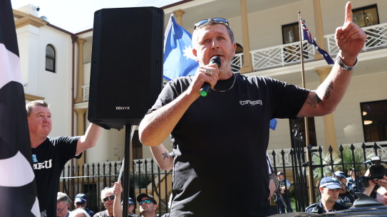 Darren Greenfield speaks at a CFMEU members protest outside NSW Parliament House.