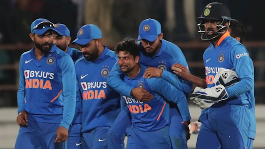 India celebrate the dismissal of Steve Smith for 98 in Rajkot.