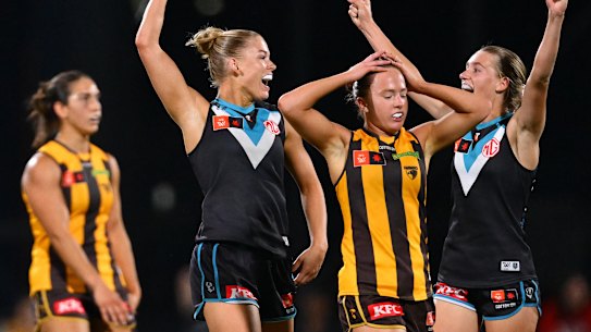 Ashleigh Saint and Ella Boag of the Power celebrate on the siren.