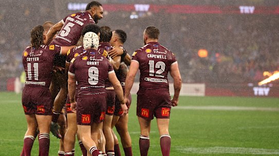 Queensland celebrate a first-half try.