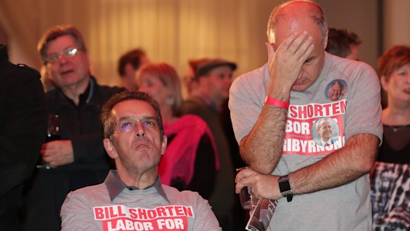 Labor supporters can't hide their disappointment as results come in on Saturday night. 