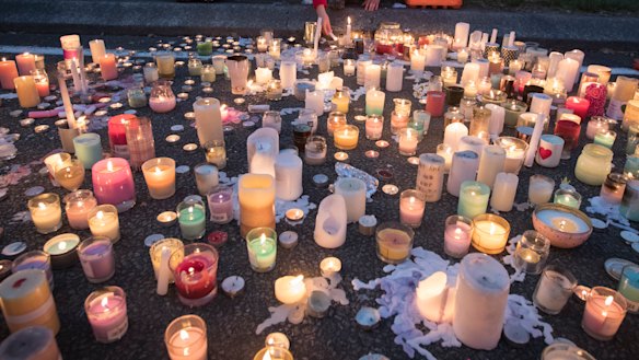 Candles burn outside Al Noor mosque in honour of those killed.