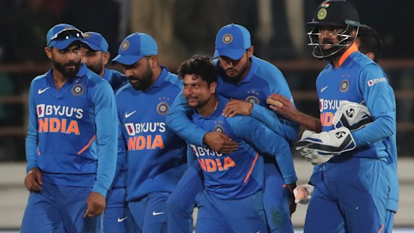 India celebrate the dismissal of Steve Smith for 98 in Rajkot.