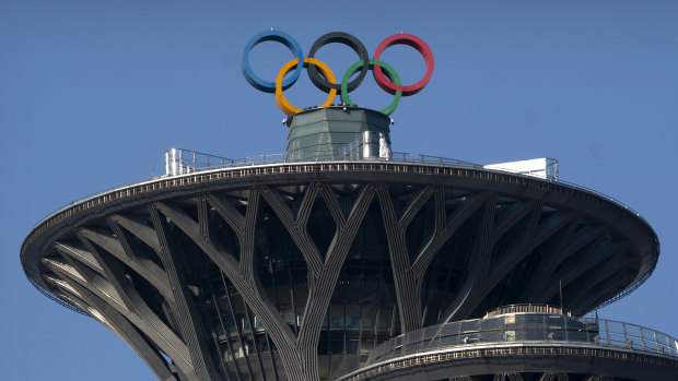 Olympic rings are visible atop the Olympic Tower in Beijing. 