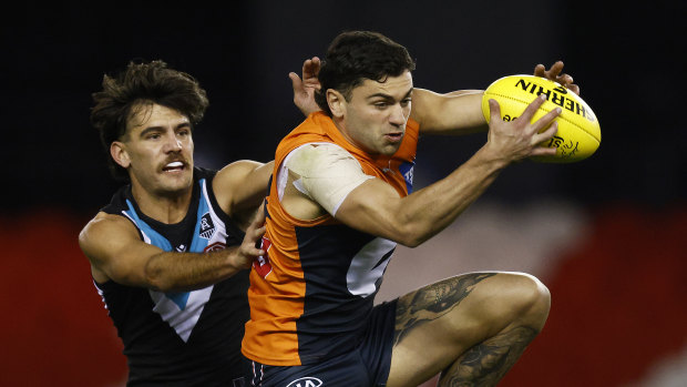 Tim Taranto of the Giants gets ahead of his opponent to take a mark at Marvel Stadium.