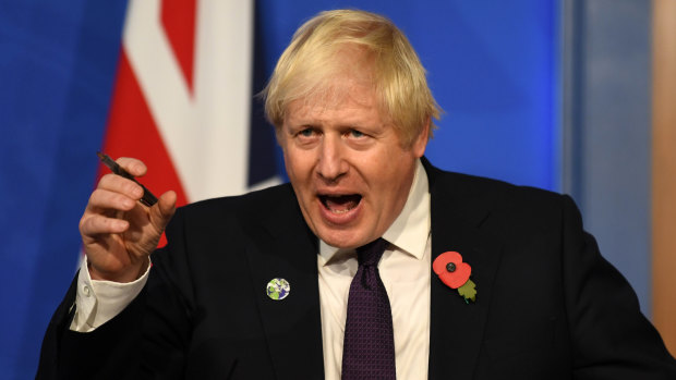 Britain’s Prime Minister Boris Johnson speaks during a press conference inside the Downing Street Briefing Room in London, England. 