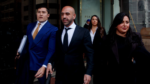 Tamer Uzun (centre) leaves the Downing Centre District court in July 2024.