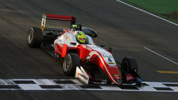 Mick Schumacher and his winning vehicle.