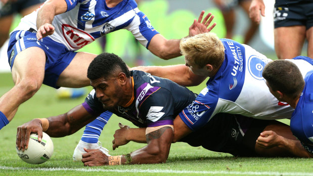Line ball: Tui Kamikamica scores a try for Storm during the round 4 match against Canterbury Bulldogs at AAMI Park in Melbourne.