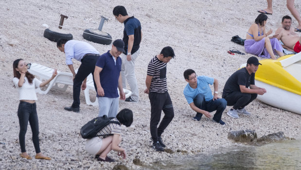 Chinese workers on a public beach in Komarna, Croatia, near the site where a bridge connecting Dubrovnik to the rest of Croatia will be built.