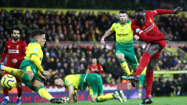 Sadio Mane of Liverpool breaks the deadlock against Norwich City at Carrow Road.