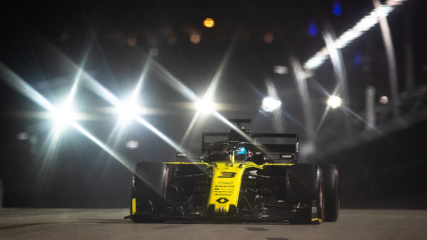 Night rider: Ricciardo driving his Renault during qualifying for the F1 Grand Prix of Singapore at the Marina Bay Street Circuit.