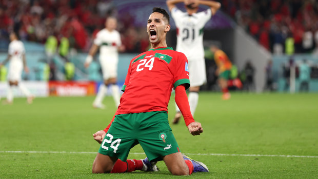 Badr Benoun celebrates Morocco’s famous win.