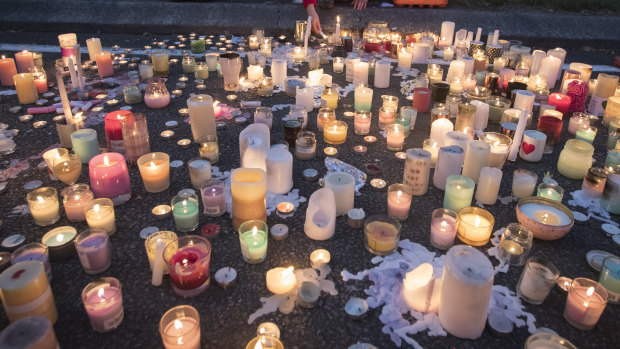 Candles burn outside Al Noor mosque in honour of those killed.