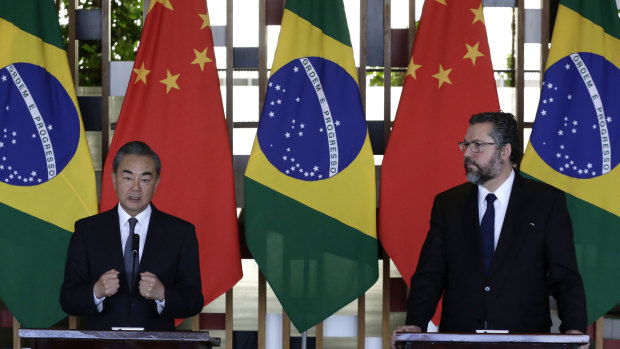 Chinese Foreign Minister Wang Yi, left, and Brazil's Foreign Minister Ernesto Araujo, take part in a joint press conference at the Itamaraty Palace, in Brasilia, onthe eve of the BRICS meeting.