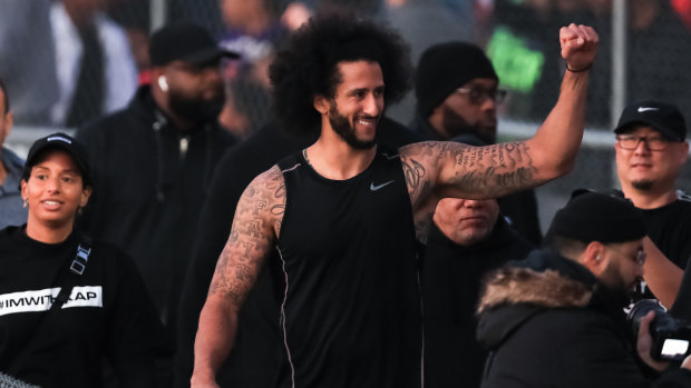 Recruitment drive: Colin Kaepernick greets fans following his NFL workout in Riverdale, Georgia.